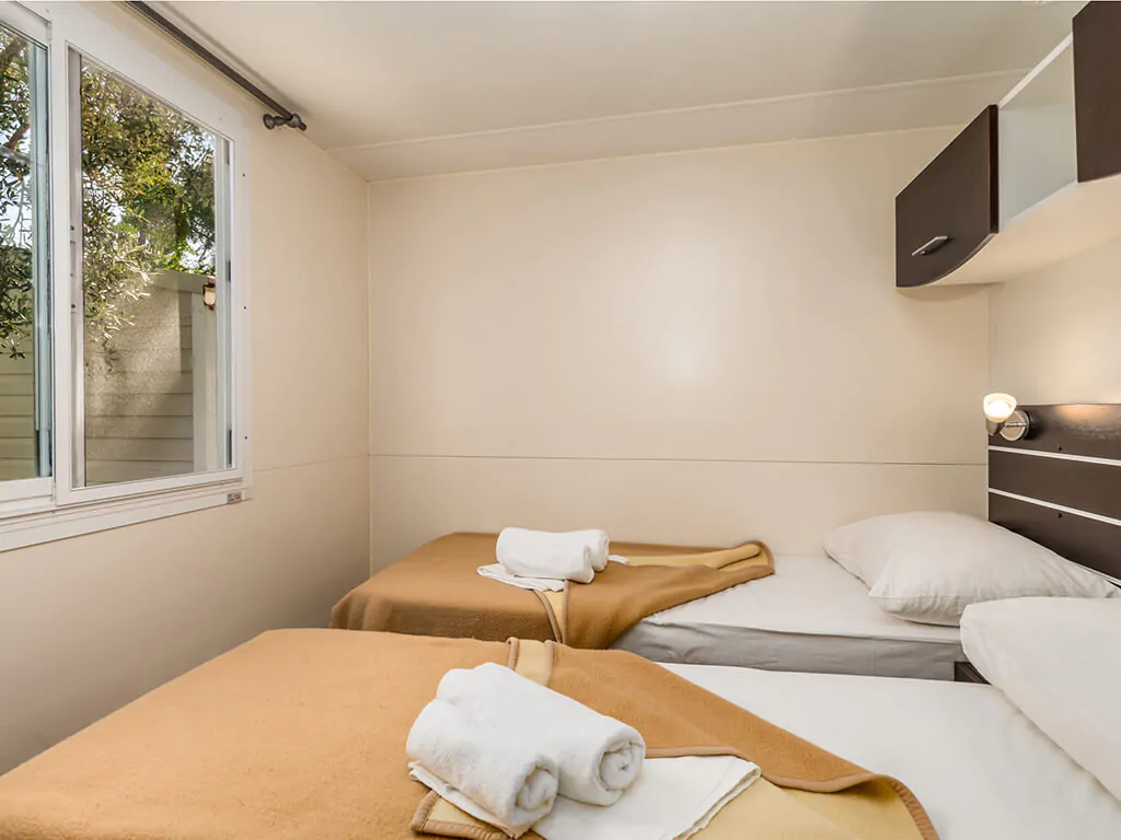 camping-porat-mobile-home-gold-interior-single-beds-2