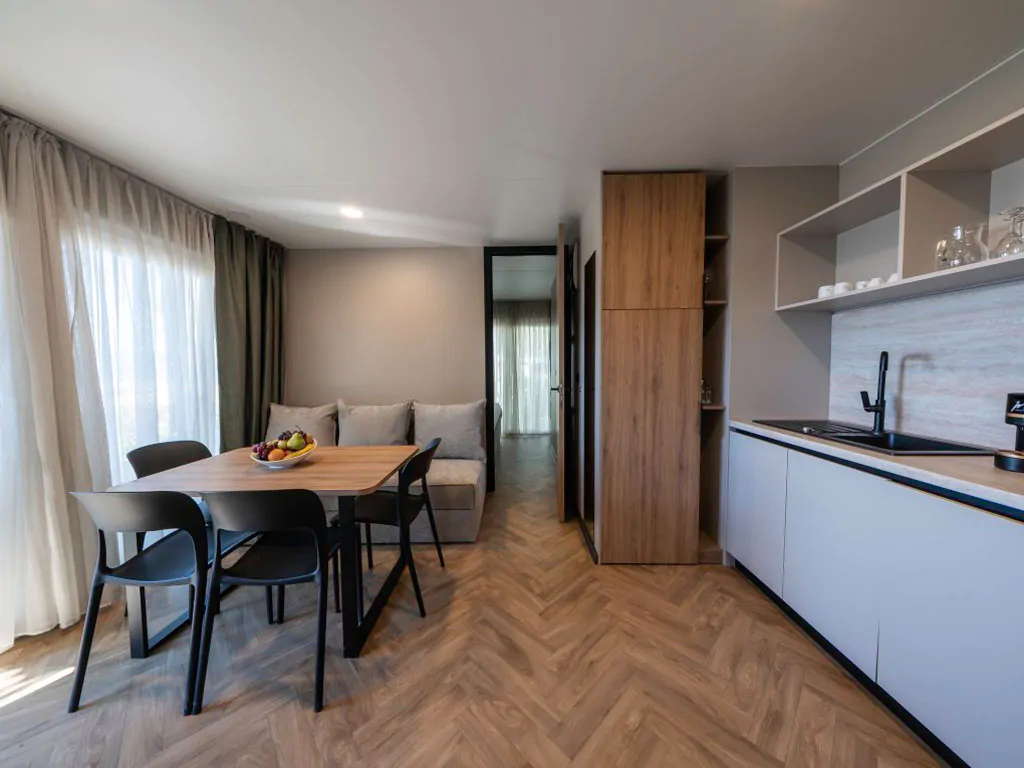 campsite-almissa-mobile-home-superior-41-interior-livingroom-kitchen-sofa
